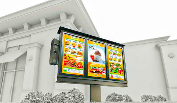 Outdoor digital menu board displaying restaurant food items and promotions, used for drive-thru and customer engagement.